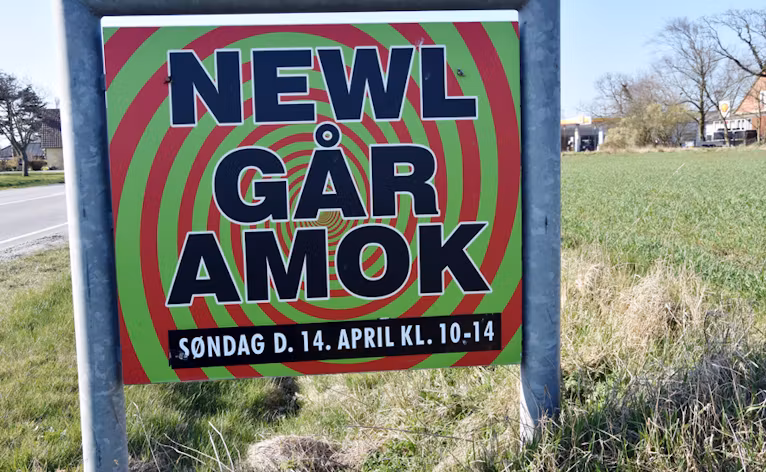 Skilt ved Byen
